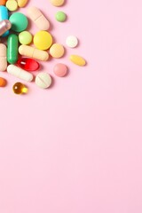 Various pills on color background, top view