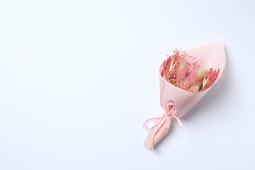 Beautiful bouquet of dry flowers on a white background