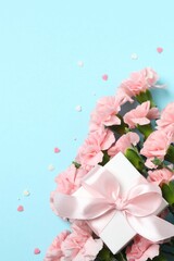Beautiful bouquet of pink carnations on a colored background