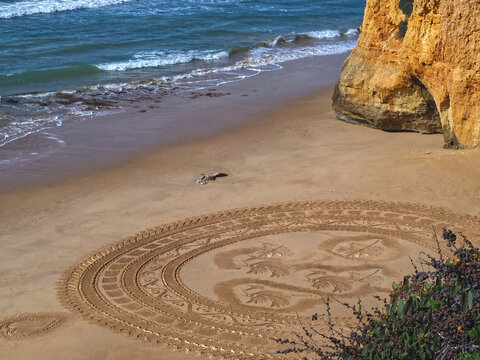 sand mandala on the beach praia Maria Luisa in Albudeira