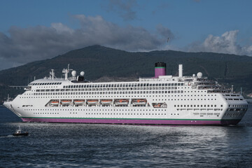 Classic cruiseship cruise ship liner Ambience sail away departure from Vigo port, Spain in Galicia...