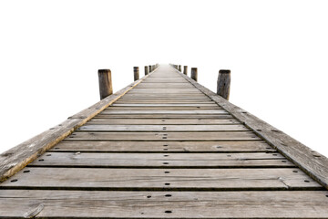 Fototapeta premium A wooden pier extends into the distance, with weathered planks and sturdy posts. The perspective creates depth, fading into a bright horizon, isolated on a transparent background