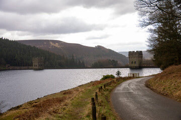 Howden Dam across the reservoir with hills behind
