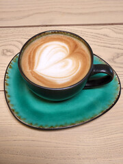 Ceramic cup green. Brewed coffee in a green cup
