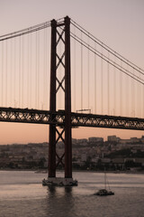 Breathtaking suspension bridge Lisbon skyline views from balcony of modern cruiseship cruise ship liner during sunset twilight blue hour