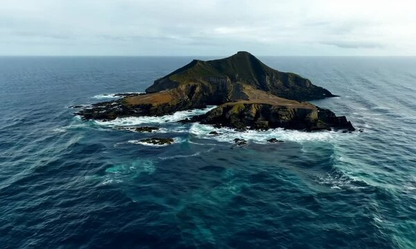 aerial view from flying drone of rocky island in Atlantic ocean