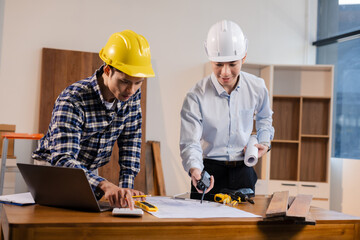 Civil engineer or architect business calculate the cost with for working building plan design project in office.