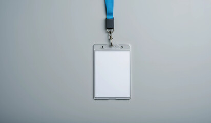 Blank white ID card in a clear plastic holder with a light blue lanyard. Perfect for mockup or branding.