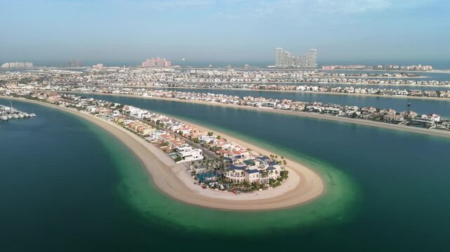 Dubai, UAE: Aerial view of capital city of Emirate of Dubai, artificial islands beach district of Palm Jumeirah - landscape panorama of Arabian Peninsula from above
