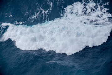 Huge crushing waves seen from above creating amazing textures.	