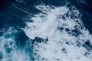 Huge crushing waves seen from above creating amazing textures.	