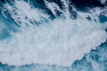 Huge crushing waves seen from above creating amazing textures. 