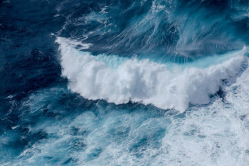 Huge crushing waves seen from above creating amazing textures. 