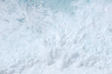 Huge crushing waves seen from above creating amazing textures.	