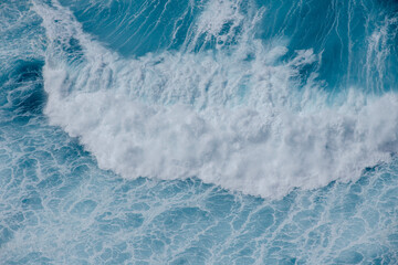 Huge crushing waves seen from above creating amazing textures.	