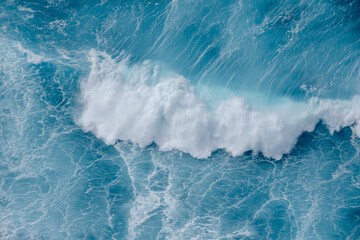 Huge crushing waves seen from above creating amazing textures.	