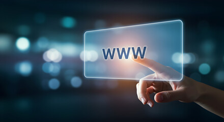 Hand Touching Www on a Glowing Screen Against Blurred Dark Background Showcasing Modern Online Digital Connectivity