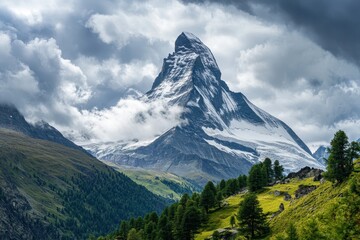Fototapeta premium Majestic matterhorn peak looming over green valley in swiss alps under cloudy sky