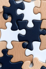 Obraz premium Close-up of interlocked wooden jigsaw puzzle pieces in black, white, and beige