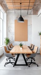 Modern conference room with long wooden table, gray chairs, and large beige artwork on exposed brick wall