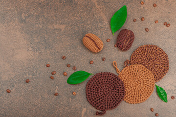 Set of crocheted dishcloth for washing dishes. Organic cleaning concept, coffee aroma, handmade pads