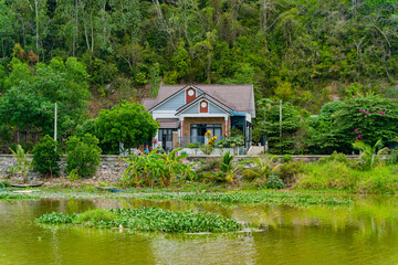Not far from Nha Trang in Vietnam. A swampy area, a small pond near a hill with dense vegetation. 