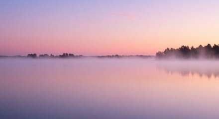 Obraz premium Serene dawn over a misty lake with soft pastel colors reflecting on the water