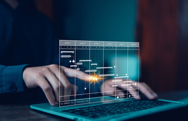 managing milestones on a timeline Gantt chart in technology online. concept of project planner in...