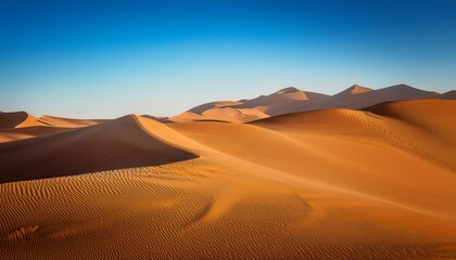serene golden sand dunes under clear blue sky in desert landscape