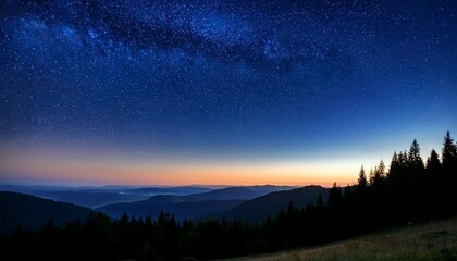 Fototapeta premium stars twinkle in a clear night sky above a serene forest silhouette and soft rolling hills creating a peaceful atmosphere at dusk