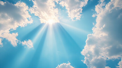 A serene and symbolic image of divine presence with sun rays breaking through soft clouds against a vast blue sky, conveying a sense of peace, spirituality, and heavenly light.


