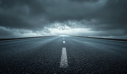 Driving Through Stormy Weather on a Long Open Asphalt Road