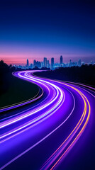 Night cityscape with winding road and vibrant light trails