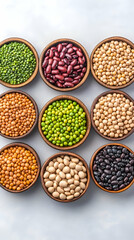 Nine bowls of various dried legumes and lentils