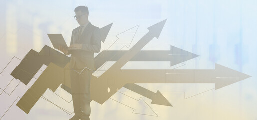 A man in a business suit and glassses uses a laptop while standing. Black and white background with geometric elements and details