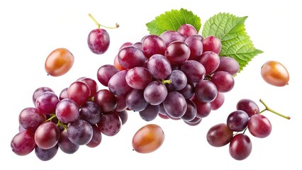 Obraz premium A Bunch of Red Grapes Falling in the Air with Some Loose Grapes and Leaves