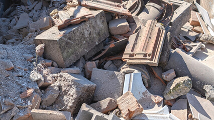 Construction debris and rubbles stock on a waste disposal site for recycling in France. Close up....