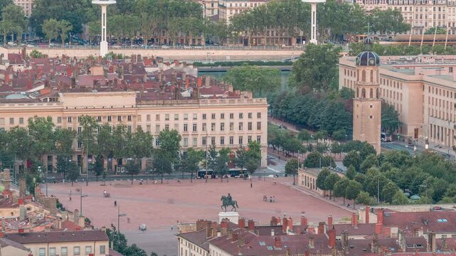 Aerial timelapse of Place Bellecour from Fourviere Hill in Lyon, France, the largest pedestrian square in Europe. Featuring the equestrian statue of King Louis XIV surrounded by historic buildings