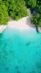 Secluded cove with pristine white sand beach and turquoise water, viewed from above