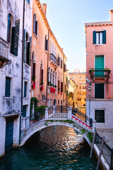 Beautiful bridge at Campo Sant'Angelo in San Marcowith typical italian buildings of Venetian...