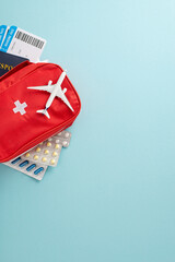 Essential travel healthcare preparation featuring a red first aid kit, blister packs, patient...
