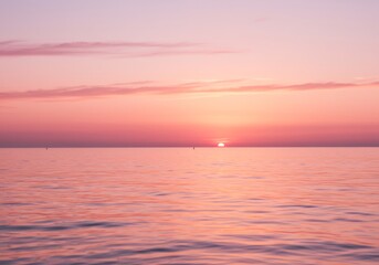 Obraz premium Serene Pink Sunset Over Calm Ocean. AI Generated