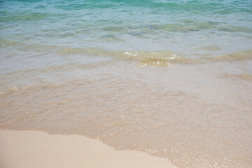 Landscape image of white beach and blue sea