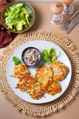 Potato Cakes with creamy mushrooms. Vegetable fritters, latkes, hash browns. Vegetable pancakes....