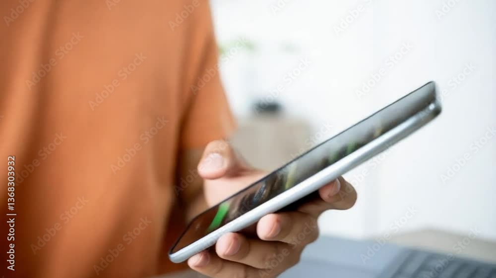 Aufkleber person holds phone with customer review bubble and laptop on desk in bright indoor setting view