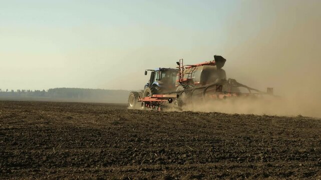 Wide Angle of Modern Tractor Towing Precision Air Seeder Sowing Crops