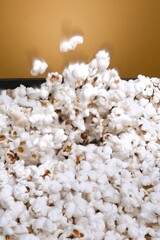 popcorn on bowl and yellow background