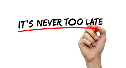 Hand Overlining It is Never Too Late Written on White Board with Red Marker for Hope and Encouragement
