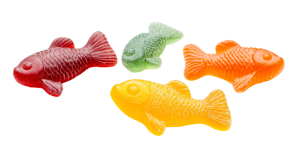 Colorful gummy fish candy assortment on black background, cut out transparent