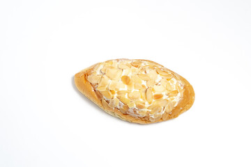A Danish Swirl pastry with almond cream and sliced almonds on top. A sweet treat with flaky layers, isolated on a white background.